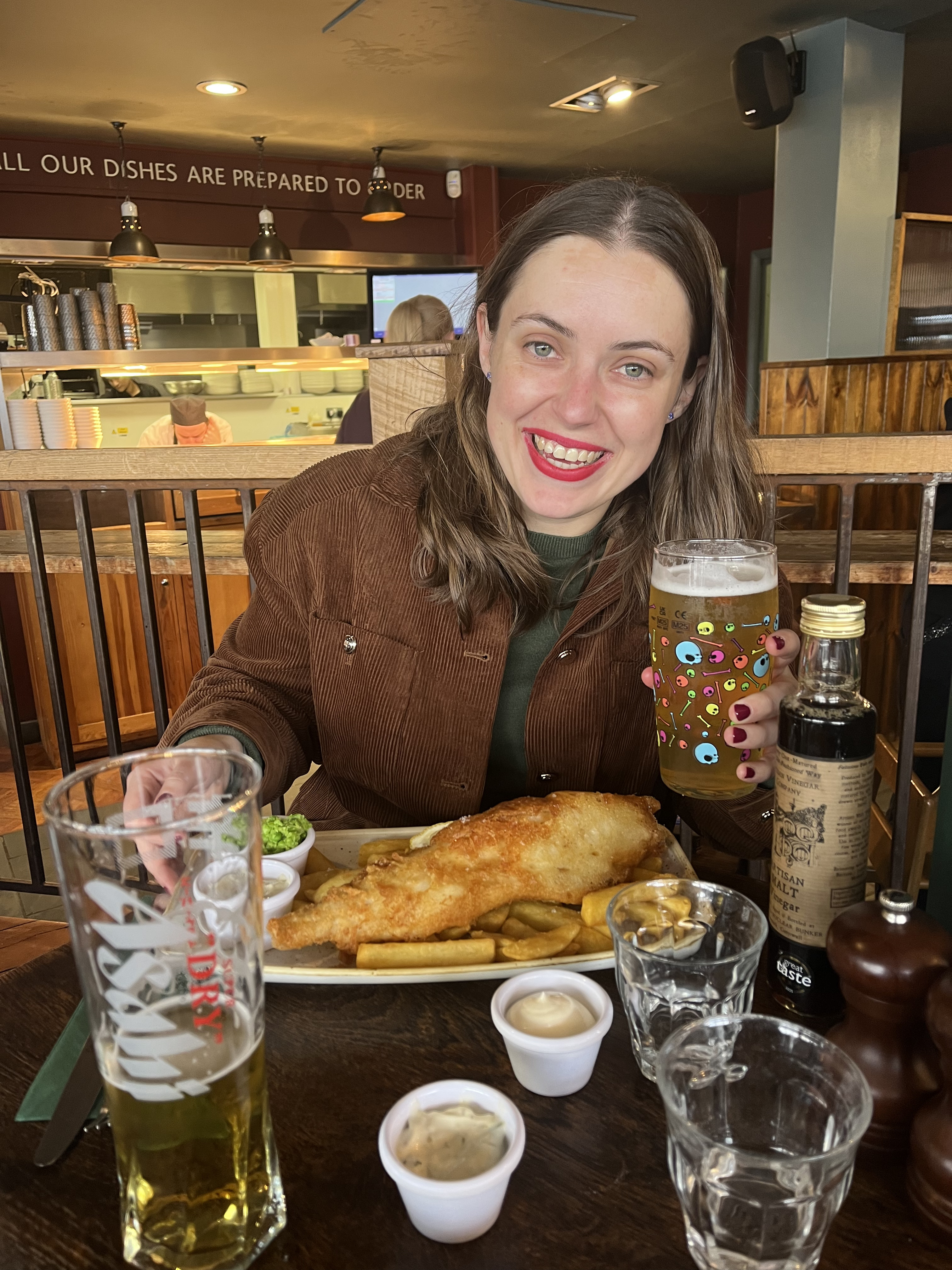 Ash enjoying her fish and chips with a Neck Oil